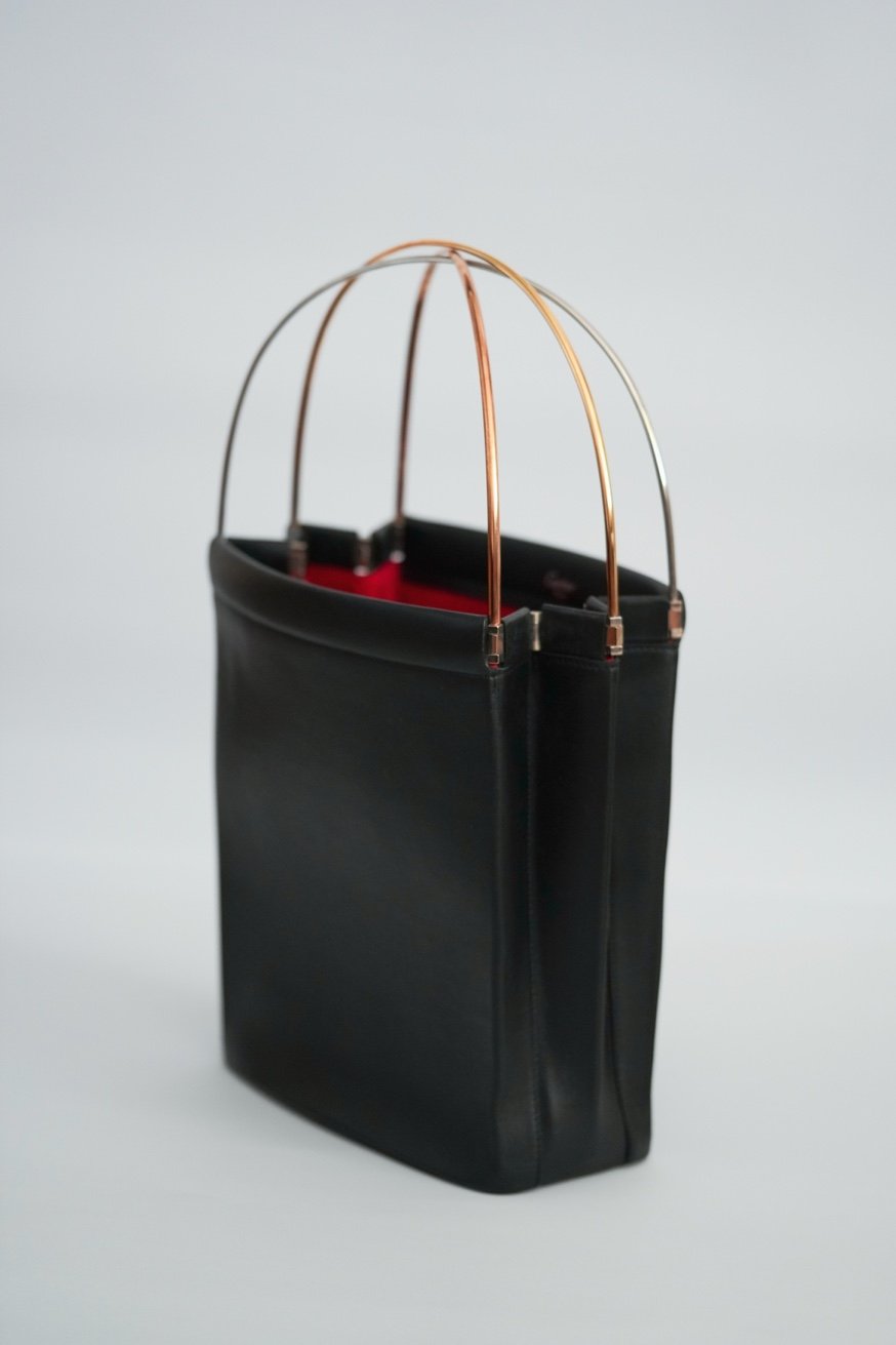 Cartier Trinity bag side view birdcage handle open
