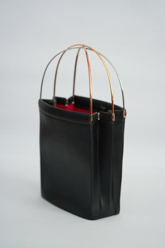 Cartier Trinity bag side view birdcage handle open