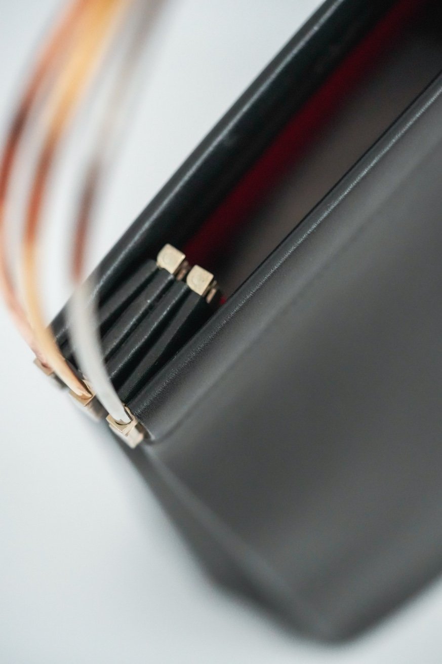 Cartier Trinity bag hardware gold bracket detail