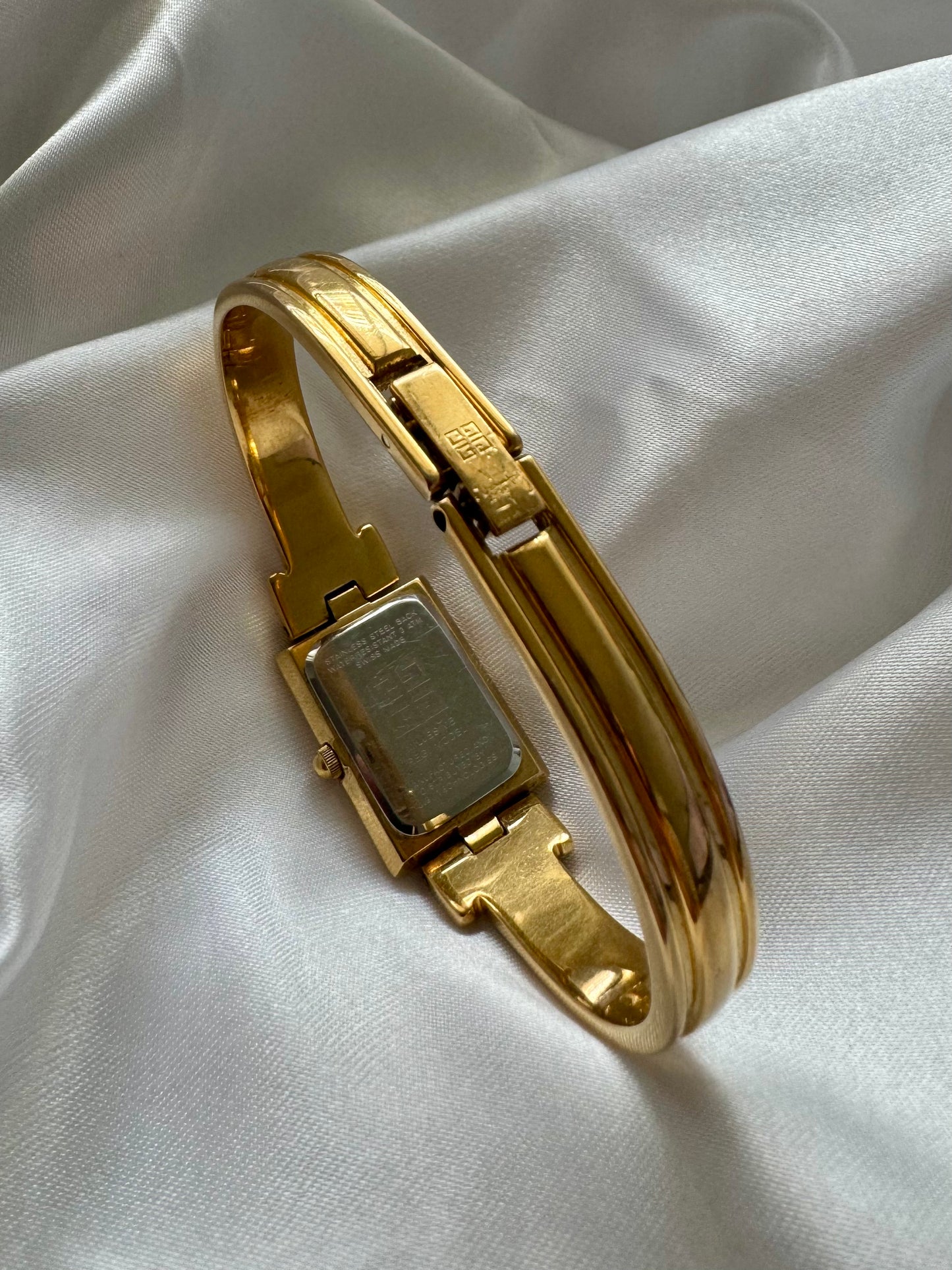 1990s Givenchy Millésime Gold-Plated Bangle Watch with Black Dial