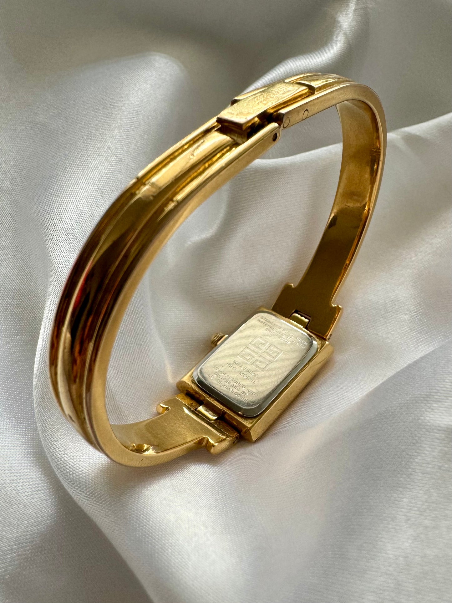 1990s Givenchy Millésime Gold-Plated Bangle Watch with Black Dial