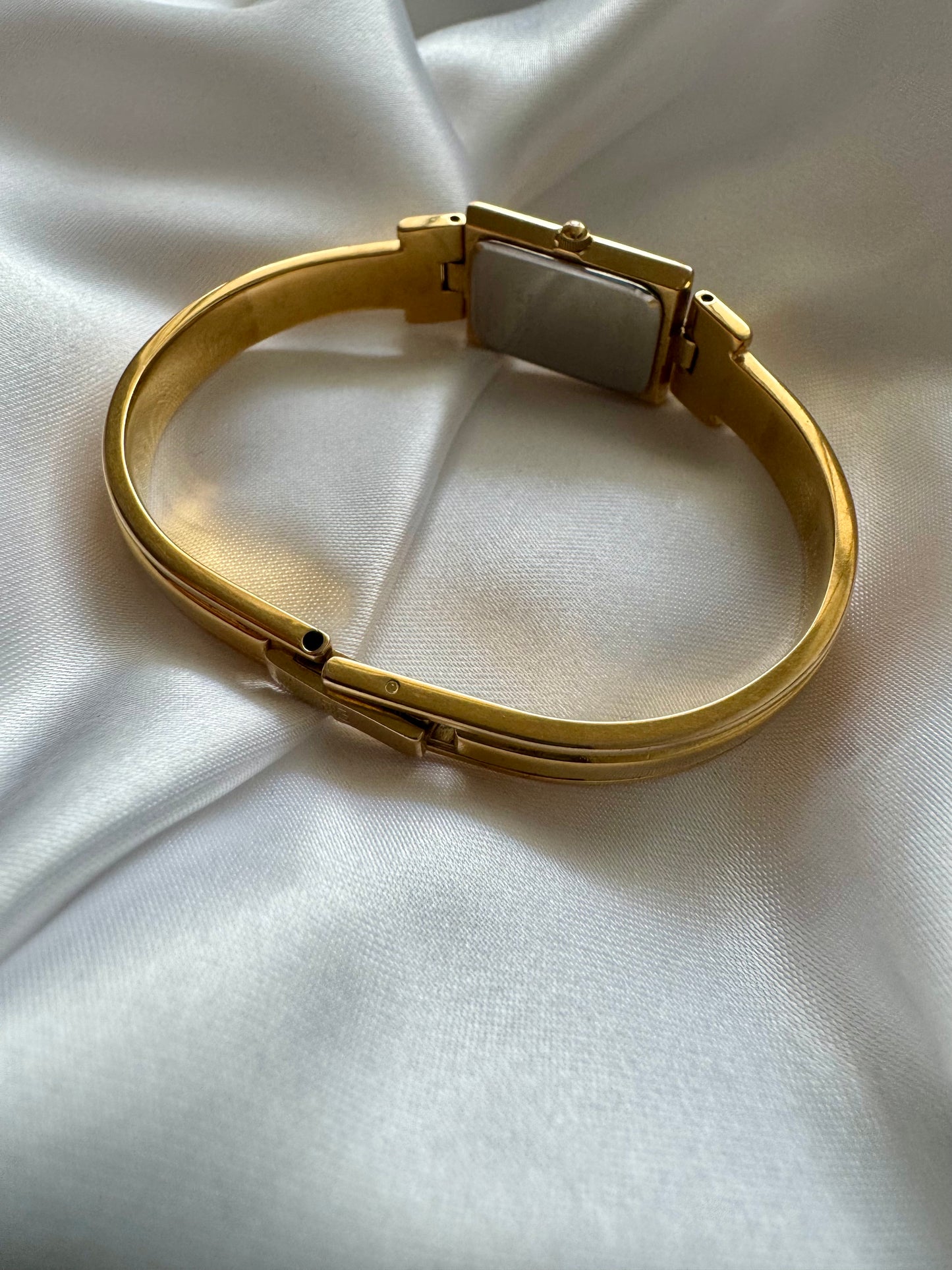 1990s Givenchy Millésime Gold-Plated Bangle Watch with Black Dial