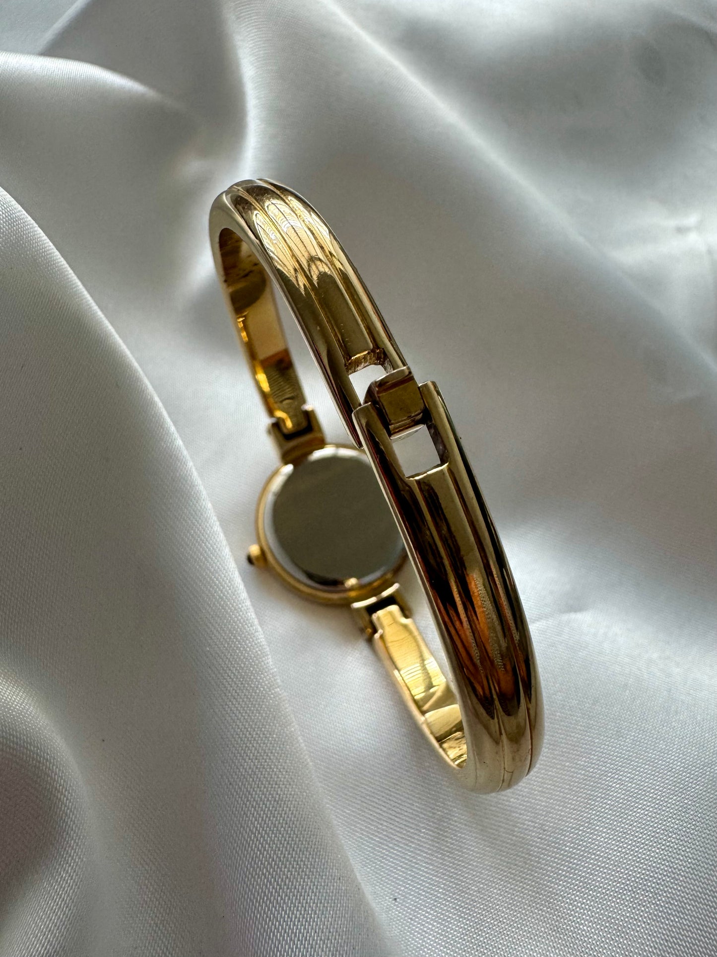 1990s Yves Saint Laurent YSL Gold-Plated Roman Numeral Bangle Watch with Black Dial