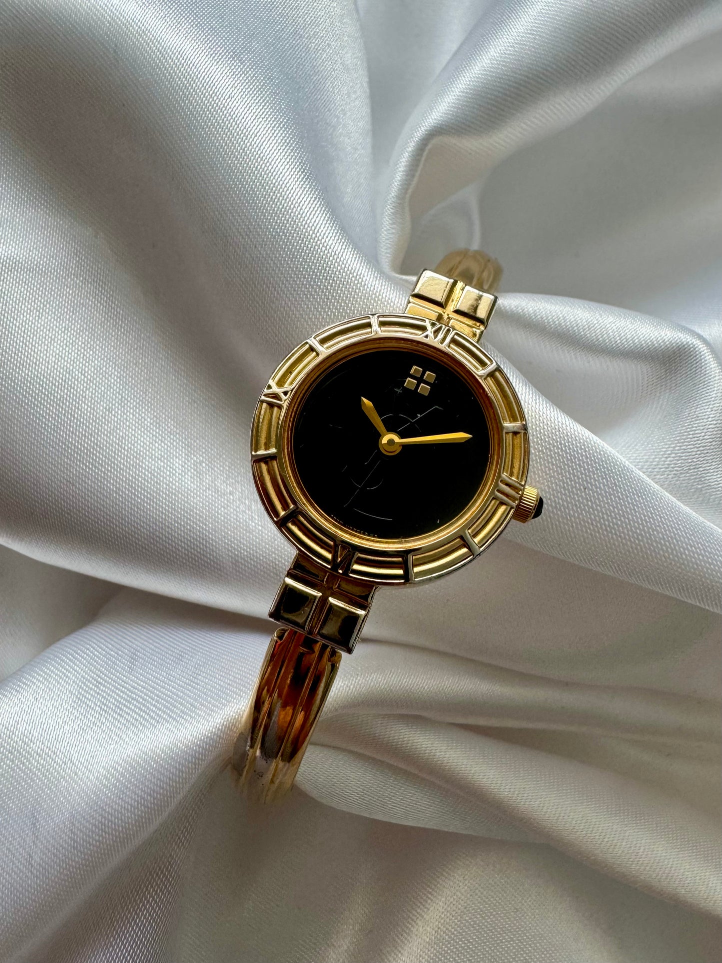 1990s Yves Saint Laurent YSL Gold-Plated Roman Numeral Bangle Watch with Black Dial