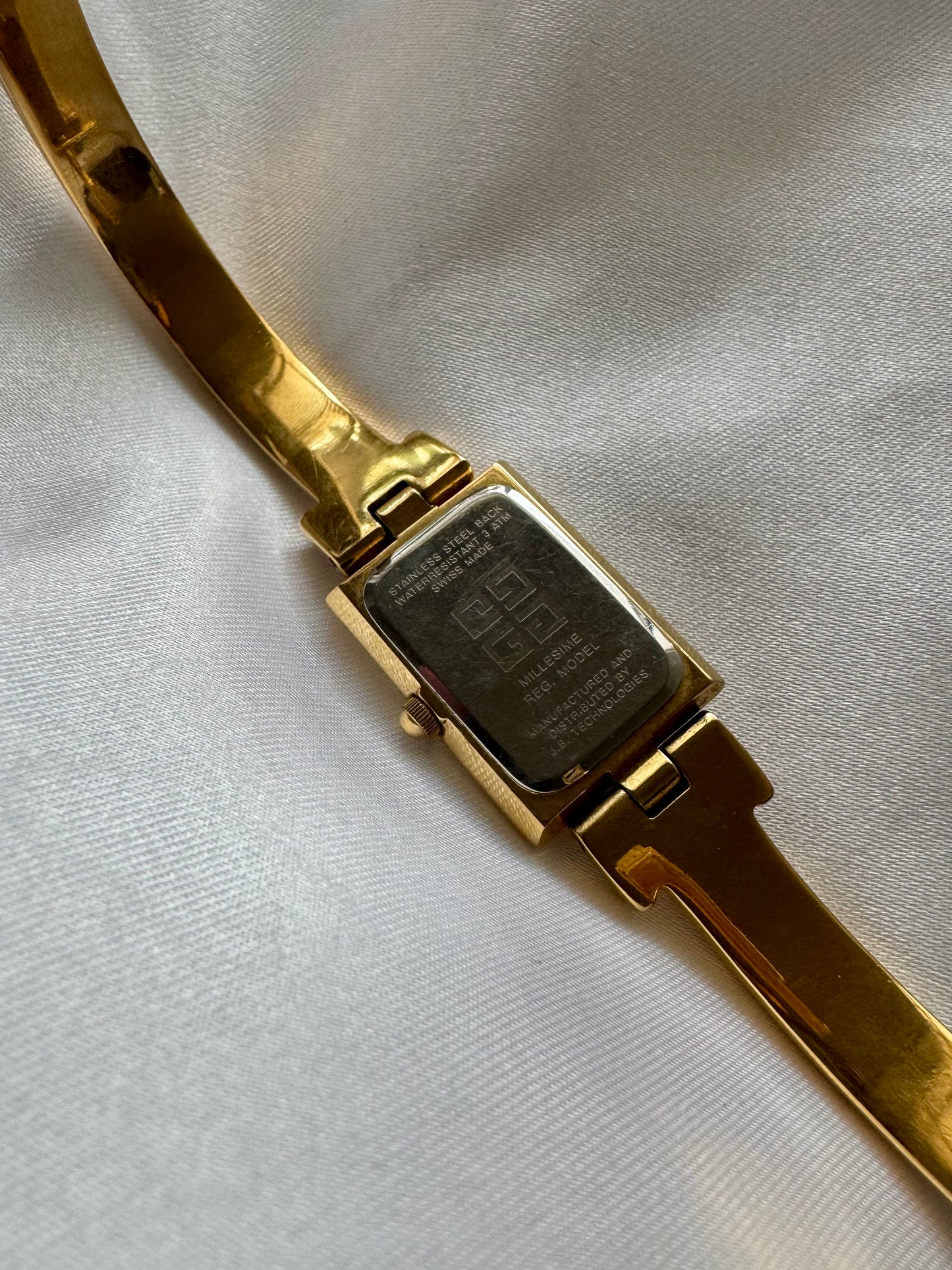 1990s Givenchy Millésime Gold-Plated Bangle Watch with Black Dial