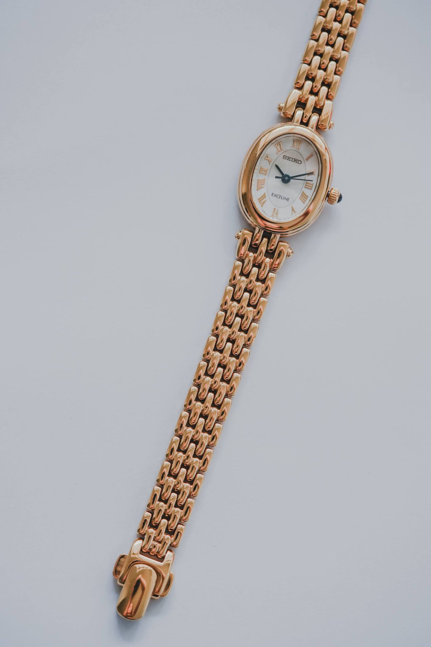 Seiko Exceline ladies watch front view yellow gold panther bracelet clasp visible