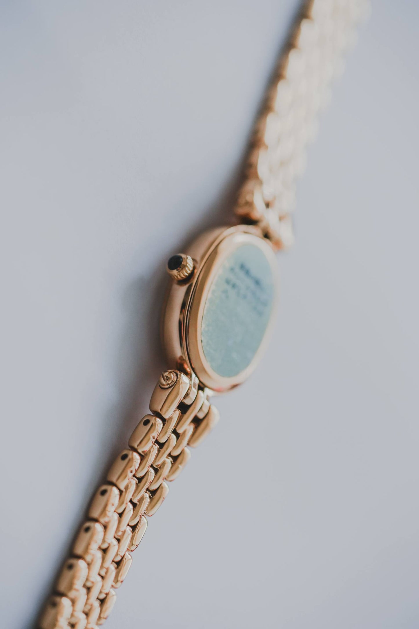 Seiko Exceline slim 7mm oval case side profile yellow gold sapphire cabochon crown