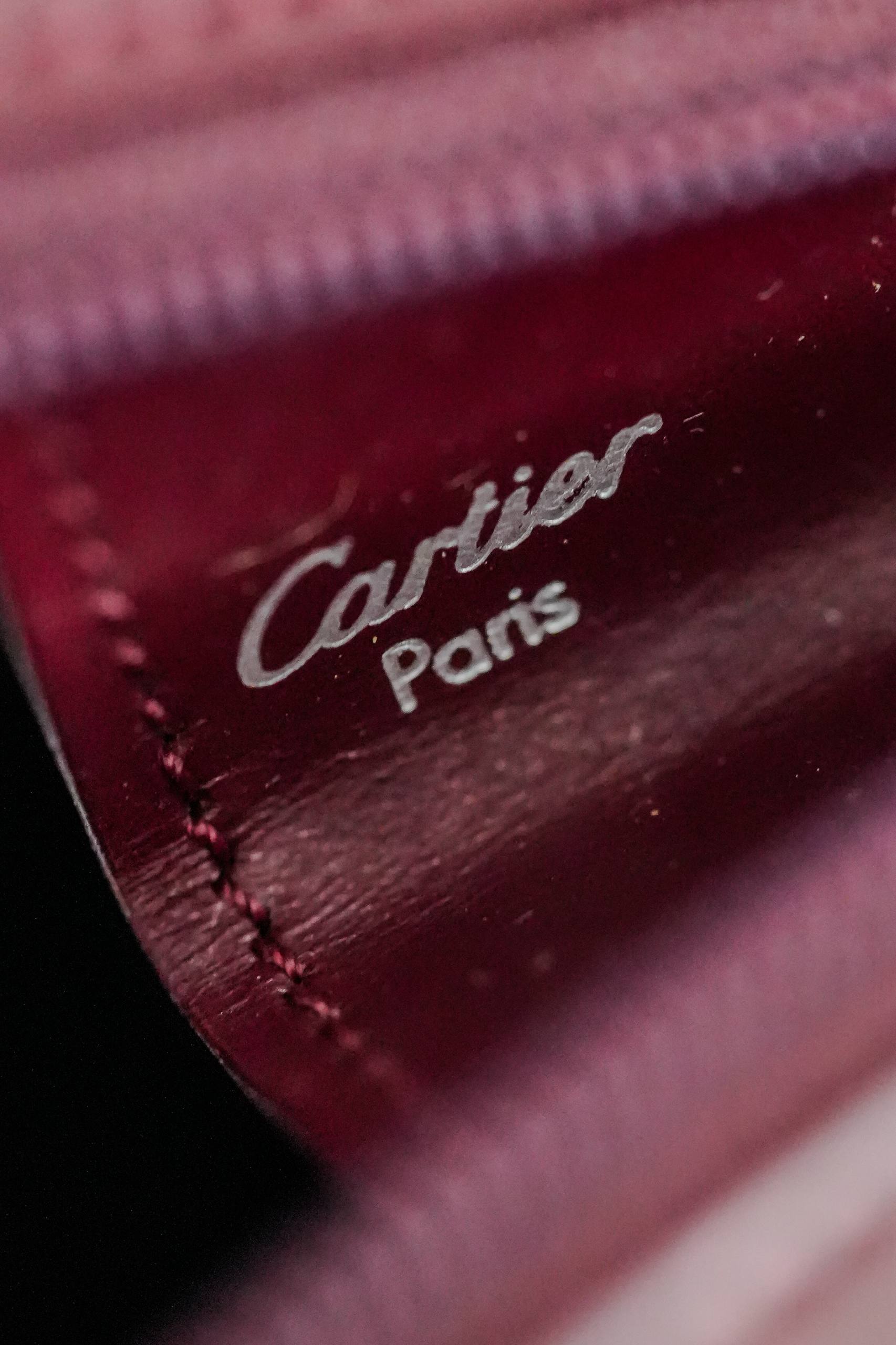 Cartier Trinity clutch interior burgundy leather lining Cartier Paris silver stamp authentication