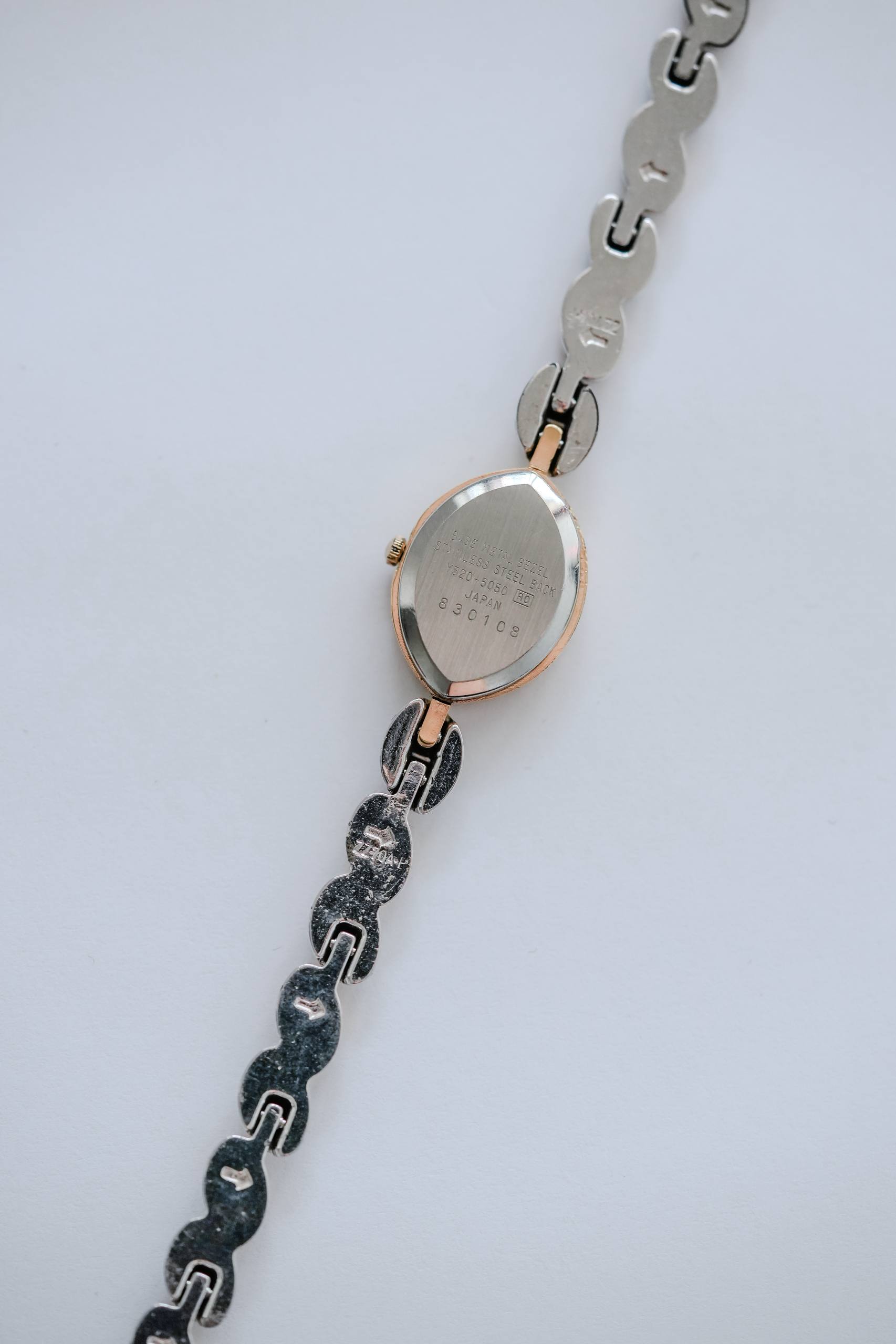Seiko Alba gold-tone oval case crown side profile