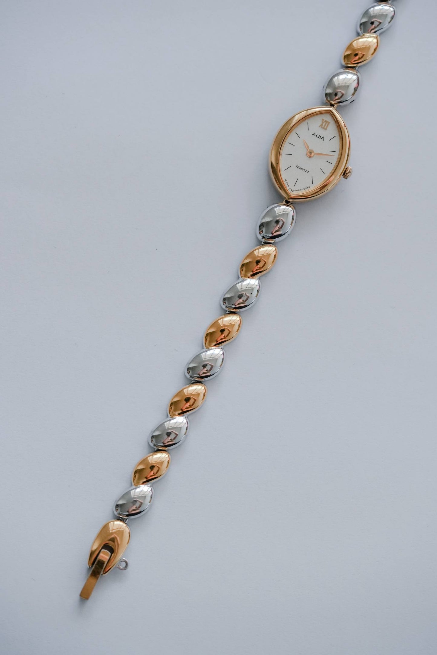 Seiko Alba two-tone bracelet gold silver pebble links detail